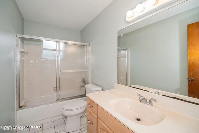 bathroom with tile patterned floors, enclosed tub / shower combo, toilet, and vanity