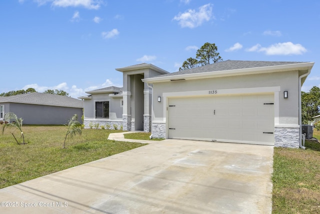 prairie-style home with a garage and a front lawn