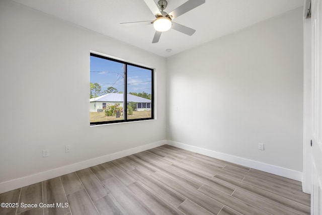 unfurnished room with ceiling fan and light hardwood / wood-style flooring