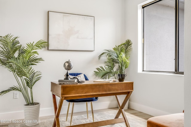 office space with light hardwood / wood-style floors