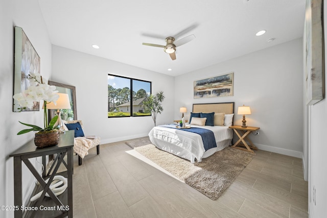 bedroom featuring recessed lighting, baseboards, wood tiled floor, and ceiling fan