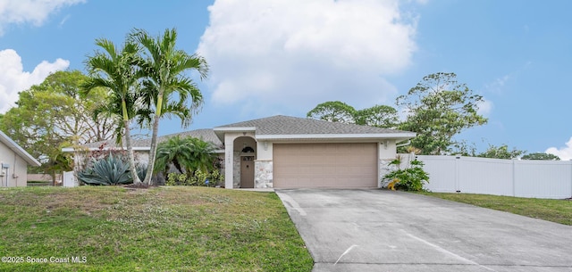 single story home with a garage and a front yard