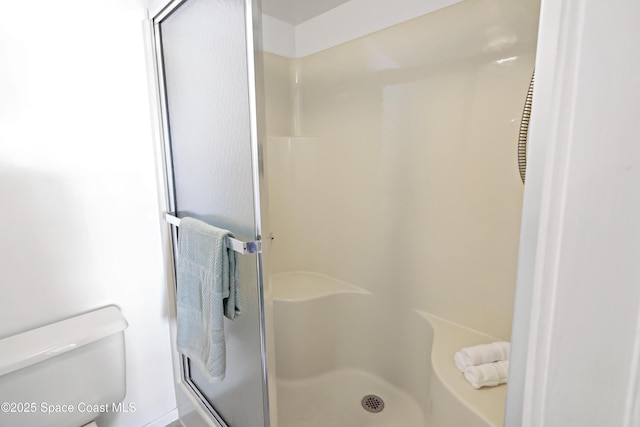 11 Plantation Dr Unit 201, Vero Beach, FL 32966 - bathroom with a shower with shower door and toilet