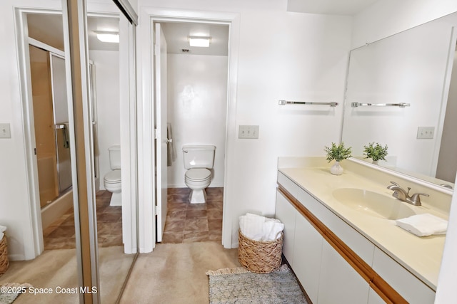 11 Plantation Dr Unit 201, Vero Beach, FL 32966 - bathroom with walk in shower, vanity, and toilet