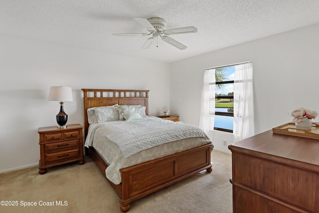11 Plantation Dr Unit 201, Vero Beach, FL 32966 - bedroom with ceiling fan, light carpet, and a textured ceiling