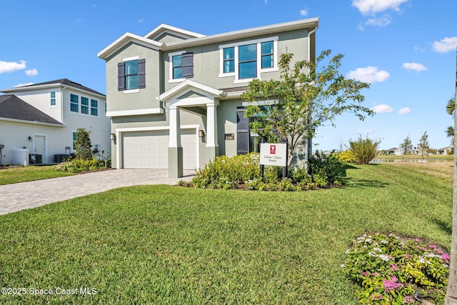 2496 Kamin Dr S, Melbourne, FL 32940 - view of front of home with cooling unit, a garage, and a front yard