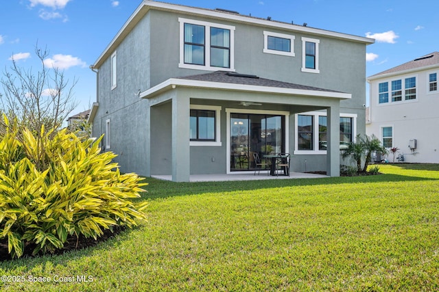2496 Kamin Dr S, Melbourne, FL 32940 - rear view of house with a yard and a patio area
