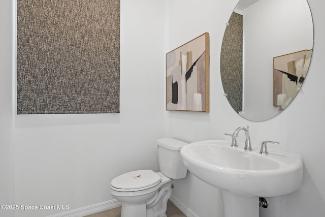 2496 Kamin Dr S, Melbourne, FL 32940 - bathroom with toilet and sink