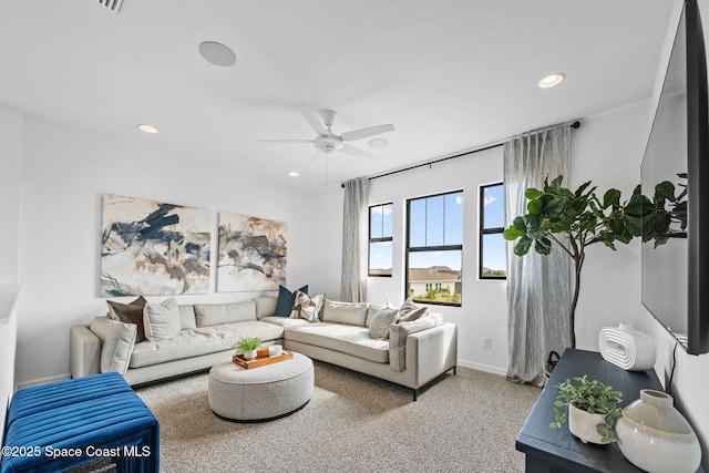2496 Kamin Dr S, Melbourne, FL 32940 - carpeted living room with ceiling fan