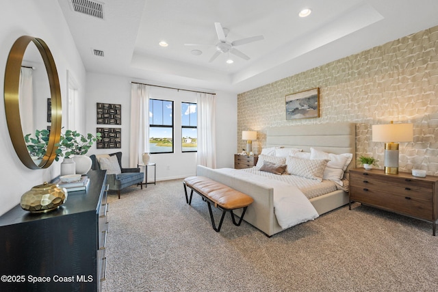 2496 Kamin Dr S, Melbourne, FL 32940 - bedroom featuring ceiling fan, a raised ceiling, and carpet
