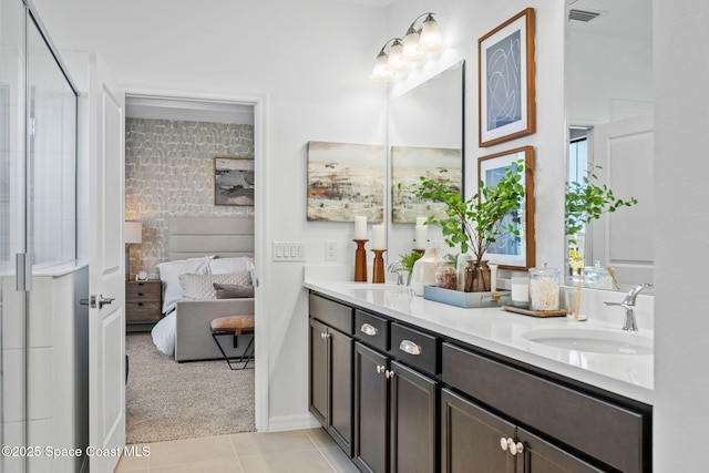 2496 Kamin Dr S, Melbourne, FL 32940 - bathroom featuring tile patterned floors and vanity