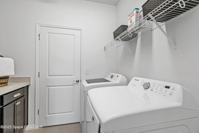 2496 Kamin Dr S, Melbourne, FL 32940 - clothes washing area with light tile patterned floors and independent washer and dryer