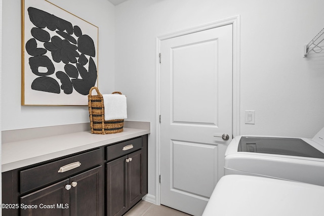 2496 Kamin Dr S, Melbourne, FL 32940 - washroom with washer and dryer and light tile patterned floors