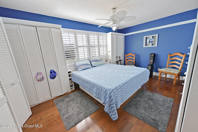 2355 Ocean Blvd Unit 11A, Stuart, FL 34996 - bedroom with ceiling fan, dark wood-type flooring, and a textured ceiling