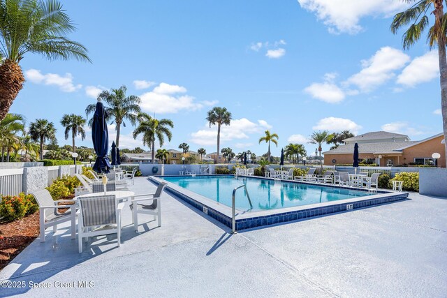 view of swimming pool featuring a patio area