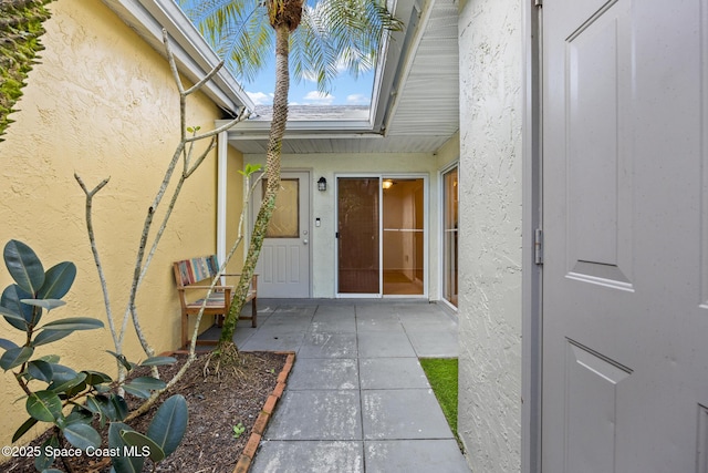 property entrance with a patio area