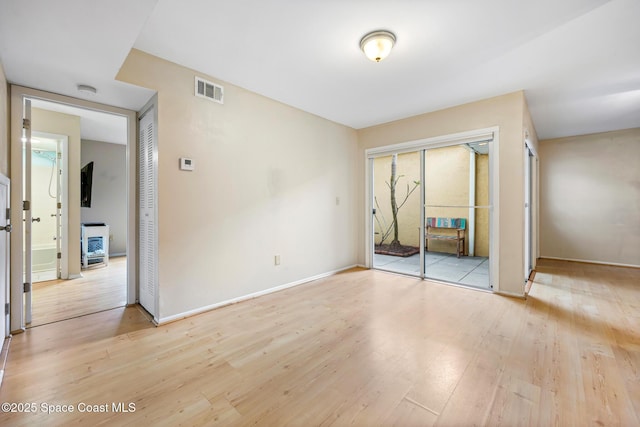 unfurnished bedroom with light wood-type flooring