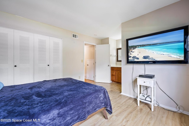 bedroom with a closet and light wood-type flooring