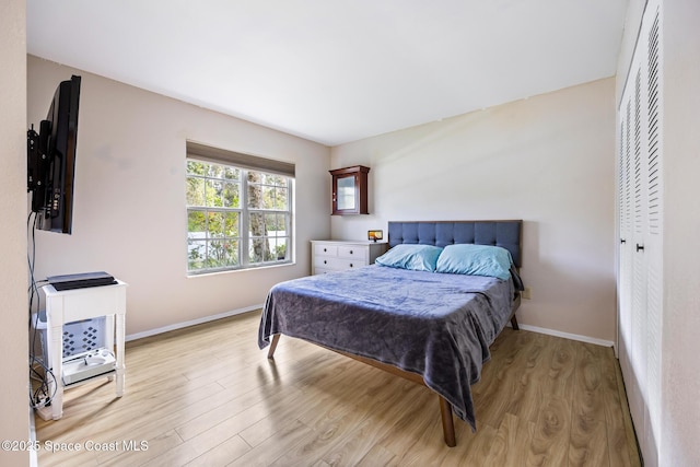 bedroom with light hardwood / wood-style floors