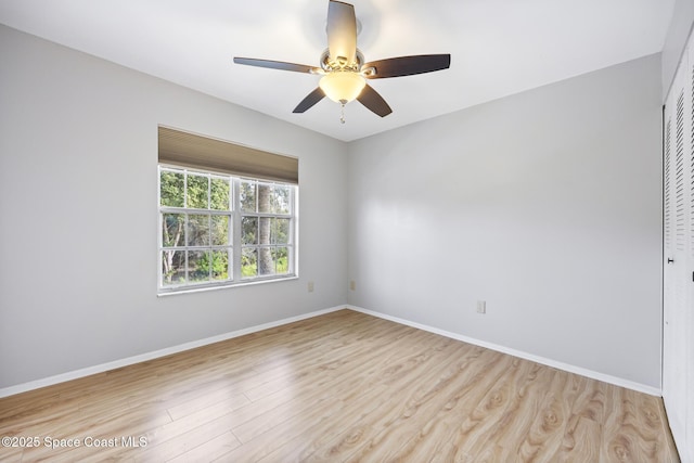 spare room featuring ceiling fan and light wood-type flooring