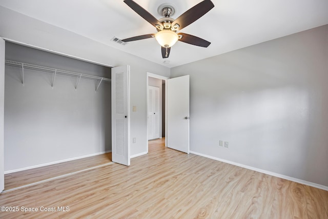 unfurnished bedroom with ceiling fan, light hardwood / wood-style floors, and a closet