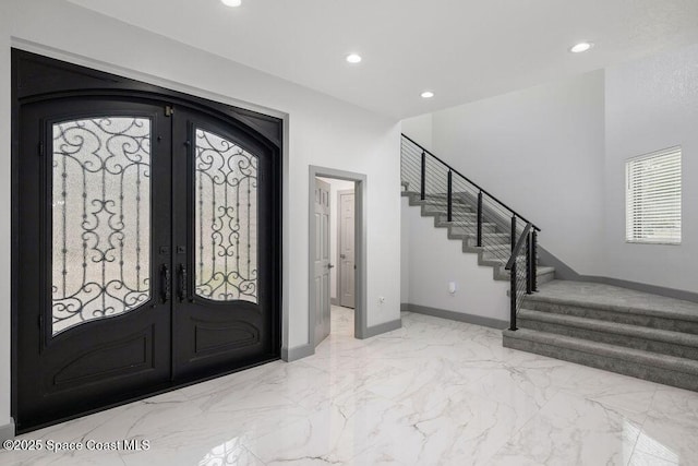 foyer entrance featuring french doors