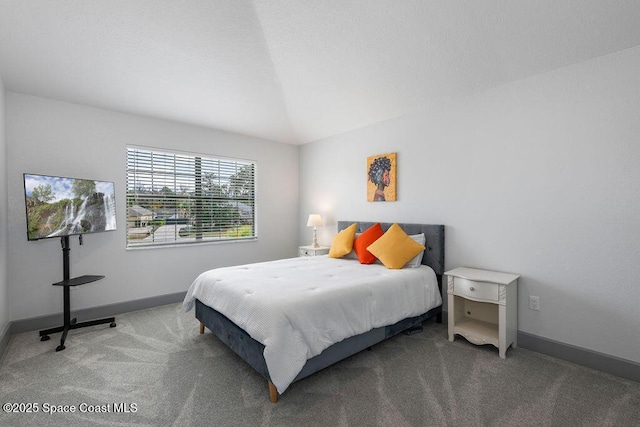 bedroom with vaulted ceiling and carpet