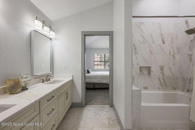 bathroom featuring vanity and lofted ceiling