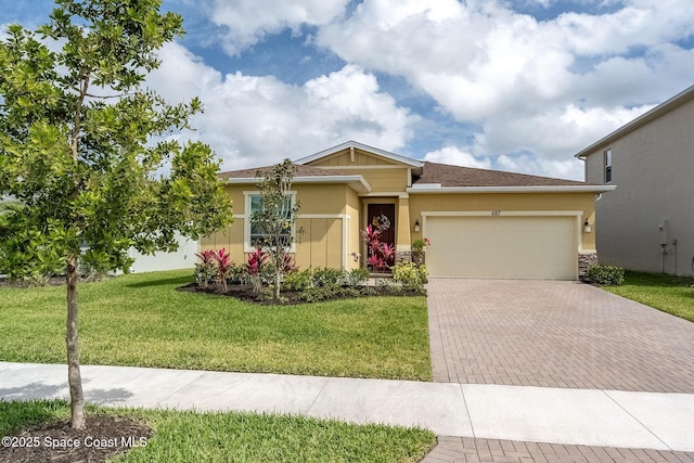 ranch-style home featuring an attached garage, a front lawn, decorative driveway, and stucco siding