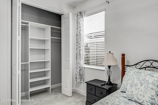 carpeted bedroom with baseboards