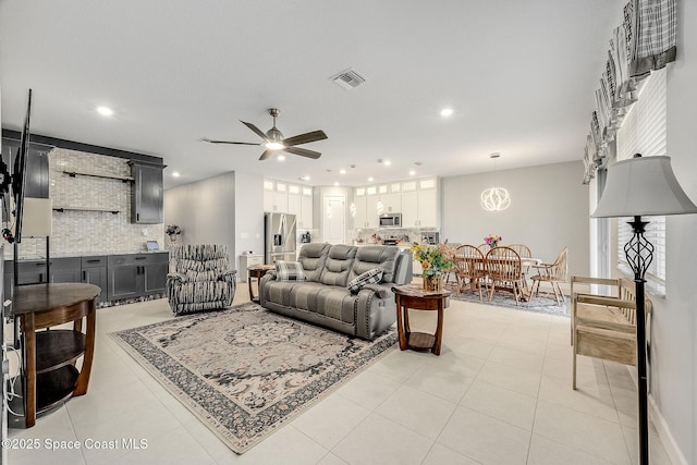 living room with ceiling fan, light tile patterned flooring, visible vents, and recessed lighting