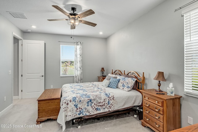 bedroom featuring light carpet, baseboards, visible vents, a ceiling fan, and recessed lighting