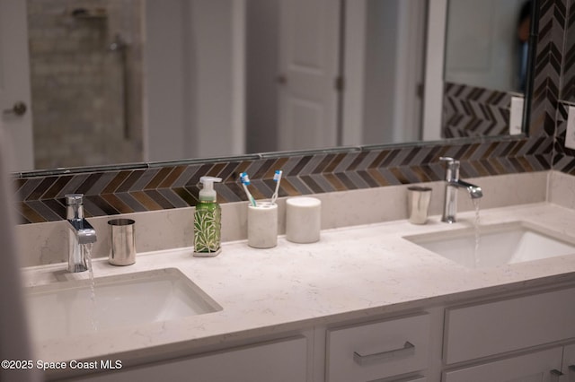 bathroom with a sink, decorative backsplash, and double vanity