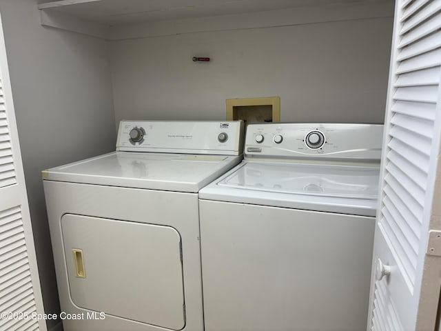 laundry room with washer and clothes dryer