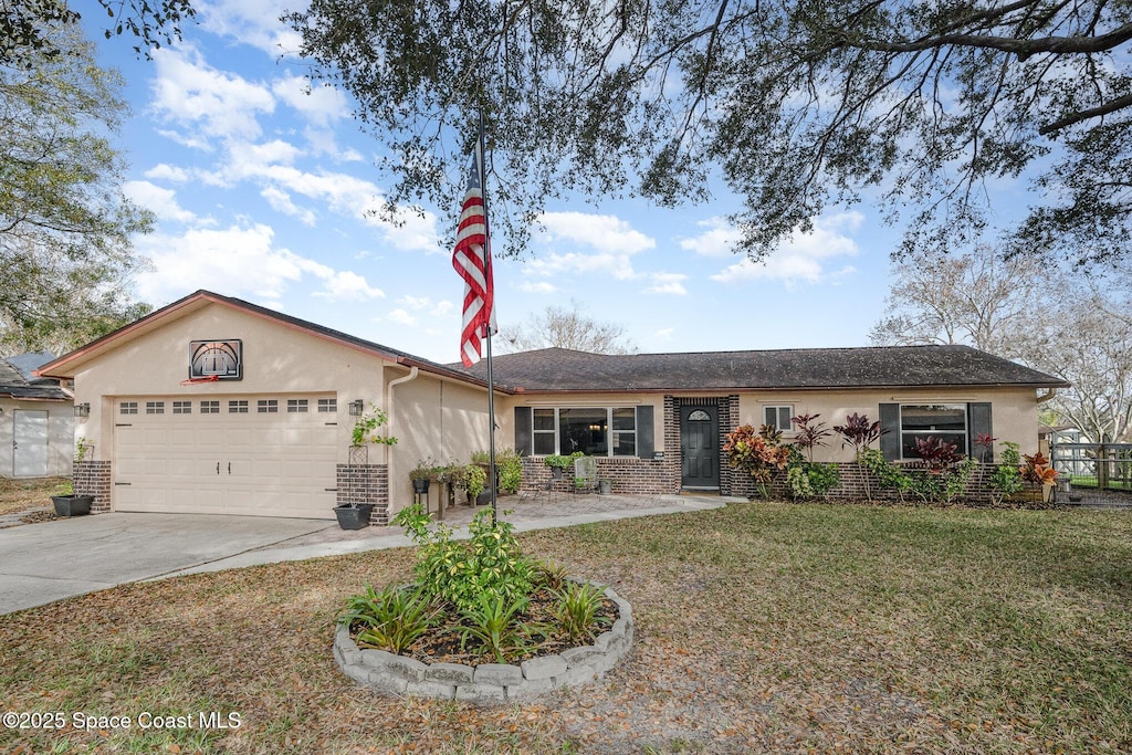 single story home featuring a garage and a front lawn