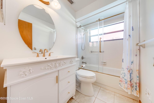 full bath featuring tile patterned flooring, toilet, visible vents, vanity, and combined bath / shower with glass door