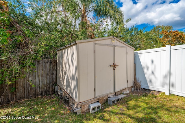 view of shed featuring a fenced backyard