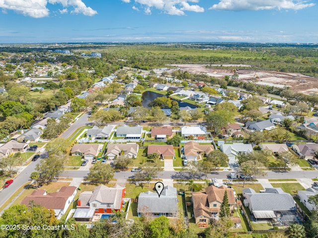 birds eye view of property with a residential view