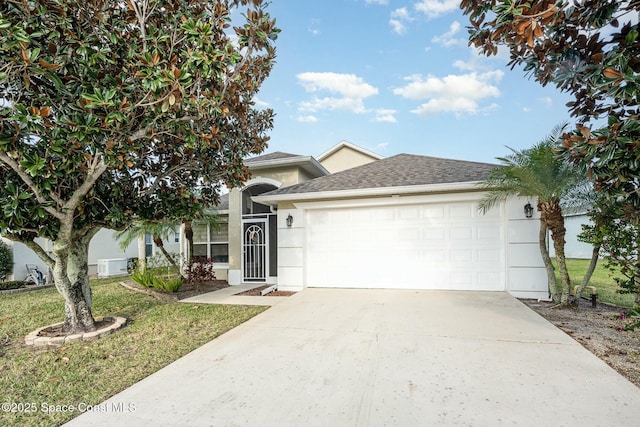 view of front of home featuring a garage and a front yard