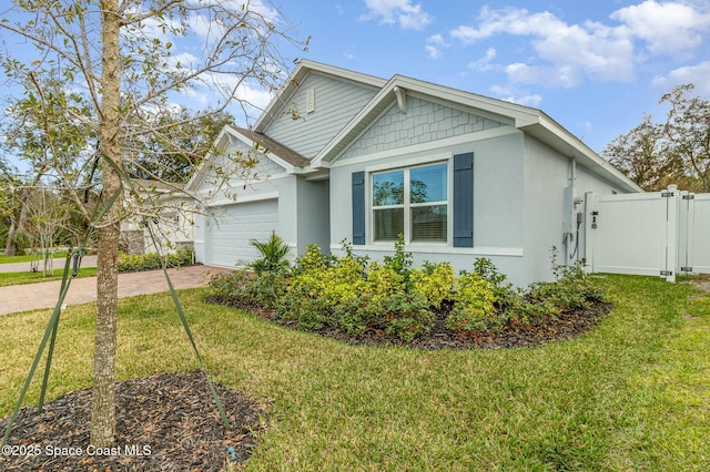 view of front of property with a garage and a front yard