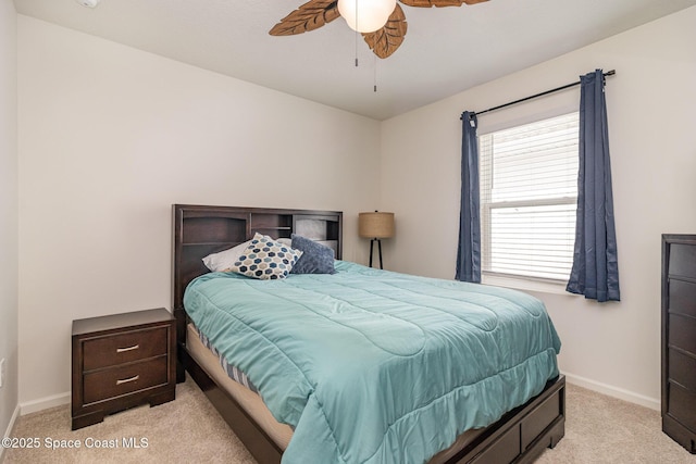 bedroom with light colored carpet and ceiling fan