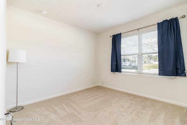 spare room featuring carpet flooring