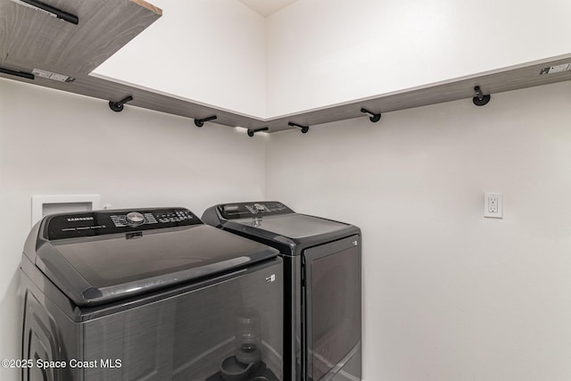 laundry room with independent washer and dryer