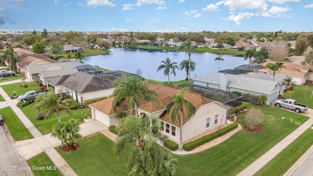 aerial view featuring a water view and a residential view