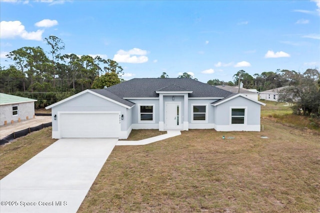 view of front of home featuring a garage and a front yard