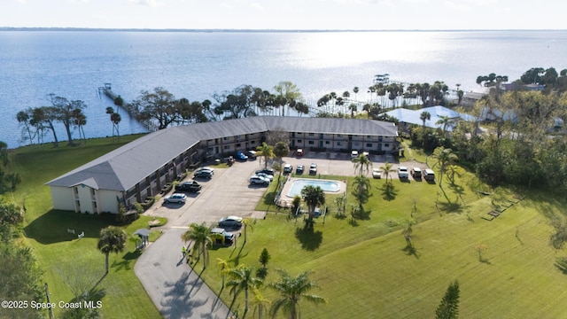 birds eye view of property with a water view