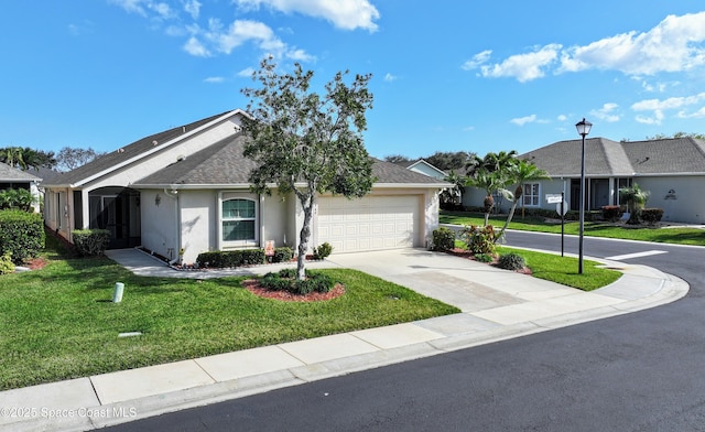 single story home with a garage and a front lawn