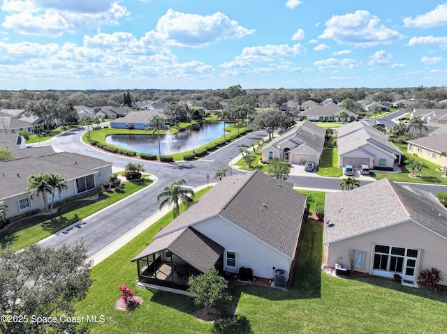 drone / aerial view with a water view