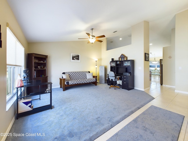 tiled living room featuring lofted ceiling and ceiling fan