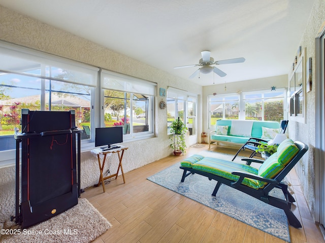 sunroom / solarium with ceiling fan